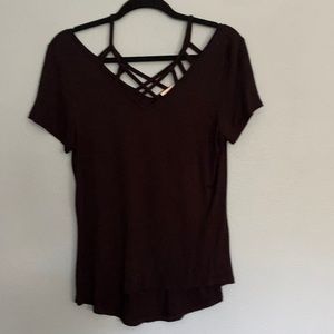 Size large black shirt with cutouts on chest one back